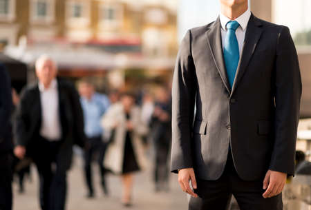 Businessman in suit, partially obscured, London, UK