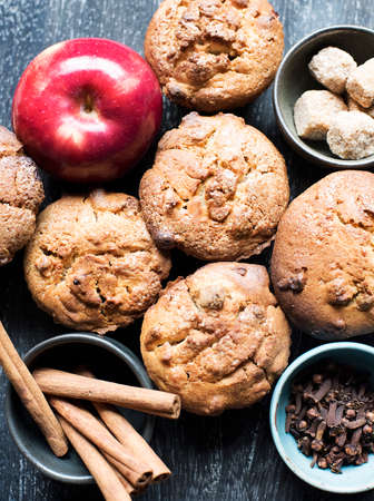 Muffins with apple, cinnamon and cloves, overhead viewの写真素材