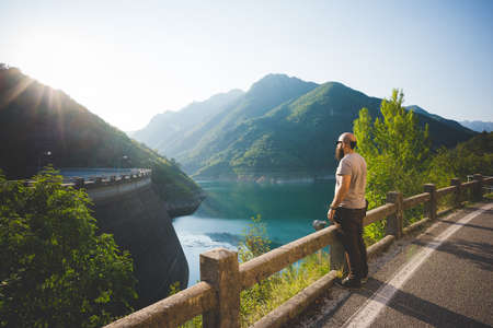 Man enjoying view of Lake Garda, Italyの写真素材