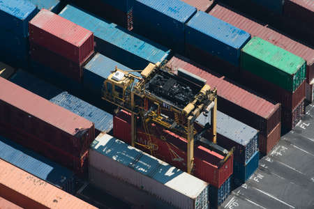 Aerial view of cargo container being retrieved, Port Melbourne, Melbourne, Victoria, Australia