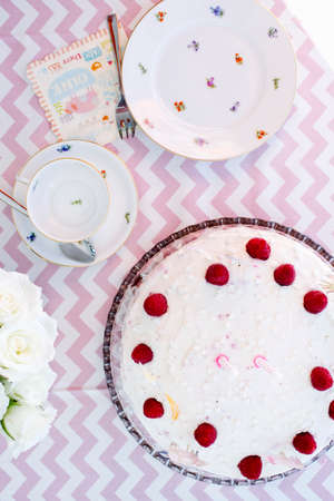 Overhead view of birthday tea party table with birthday cake and cardの写真素材