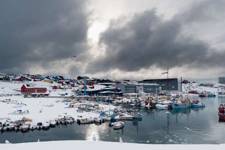 Elevated view of storm clouds over harbour, Ilulissat, Greenlandの写真素材