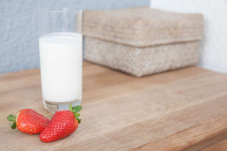Strawberries and a glass of milkの写真素材