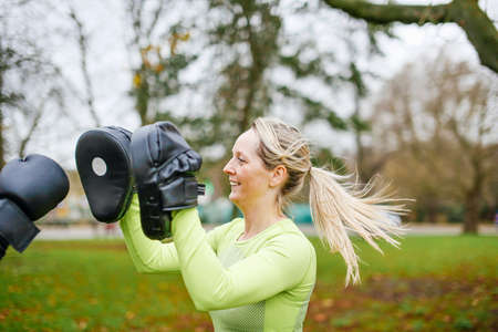 Female boxers training in parkの写真素材