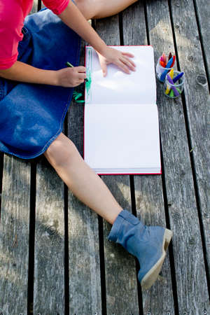 Girl drawing picture, high angle viewの写真素材