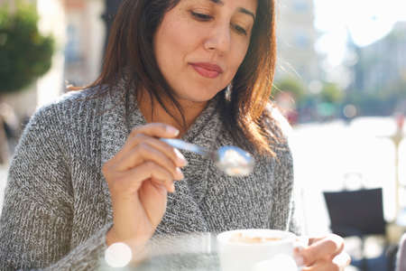 Woman having coffee