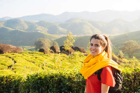 Portrait of young woman in tea plantations near Munnar, Kerala, India