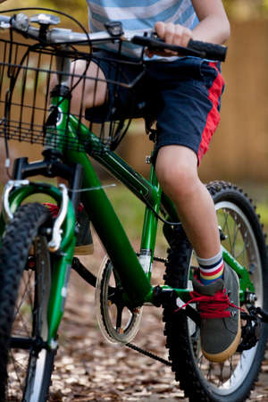 Boy riding bicycleの写真素材
