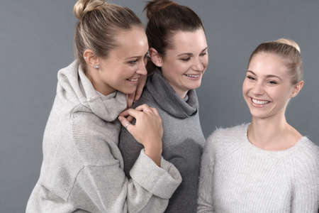 Young women smiling, grey background
