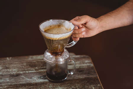 Man holding filter coffee maker