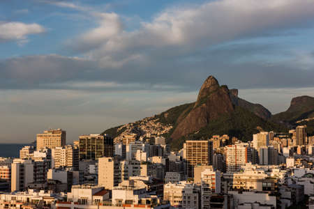 Buildings beneath mountains, Leblon, Rio de Janeiro, Brazilの写真素材
