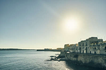 Waterfront houses on coast of Ortigia, Syracuse, Sicily, Italyの写真素材