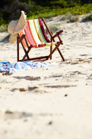 Deckchair and sunhat on beach
