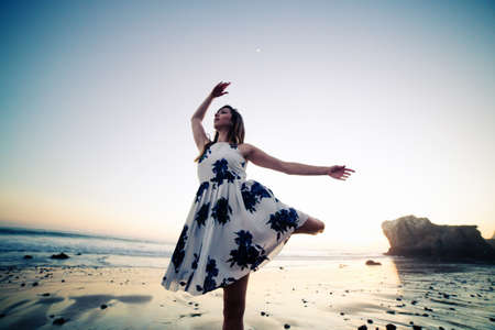 Ballerina dancing on beachの写真素材