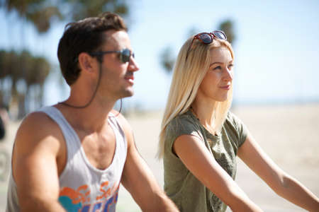 Couple on cycles at Venice Beach, Los Angeles, California, USAの写真素材