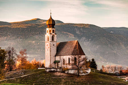 Traditional church on hill, Dolomites, Italyの写真素材