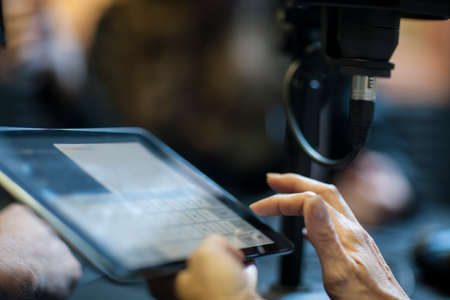 Woman using digital tablet in recording studio, close-upの写真素材