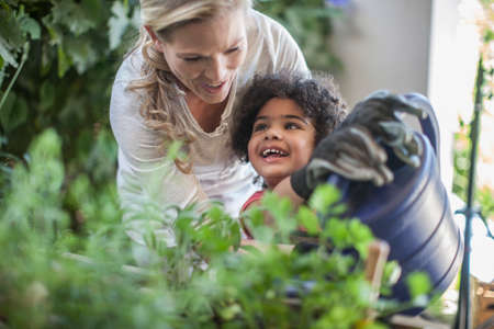 Mother and son doing gardening togetherの写真素材