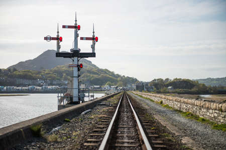 Ffestiniog railway tracks at coast, Porthmadog, Wales, UKの写真素材
