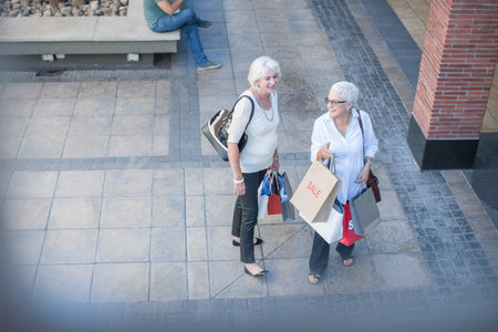 High angle view of mature women shoppers in shopping mallの写真素材