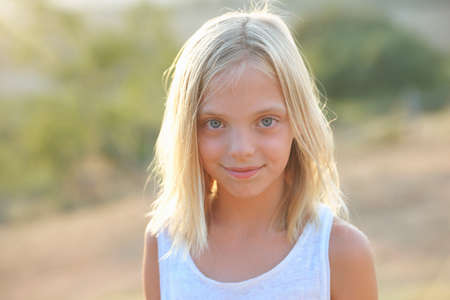Portrait of blond blue eyed girl, Buonconvento, Tuscany, Italyの写真素材