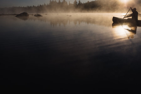 Senior man canoeing on lake