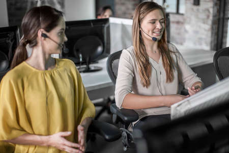 Female telephonists working in call centreの写真素材