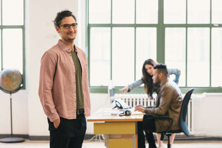 Man in office looking at camera smilingの写真素材