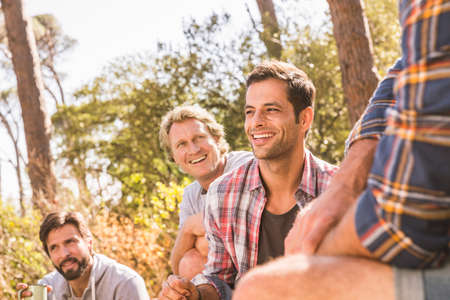 Male hiking friends chatting in forest, Deer Park, Cape Town, South Africaの写真素材