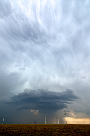 A beautiful updraft seen in a storm behind a field of wind turbines in eastern Colorado, USA