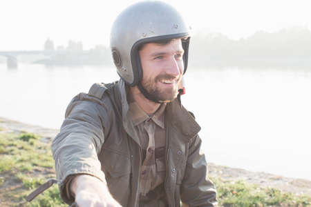 Portrait of man wearing crash helmetの写真素材