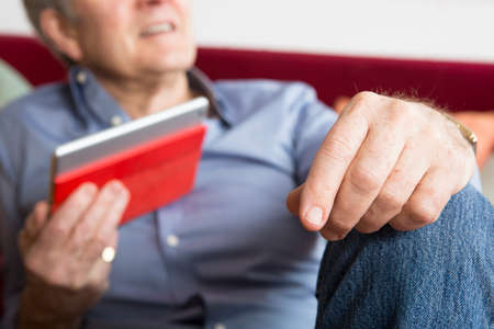 Man using digital tablet at home