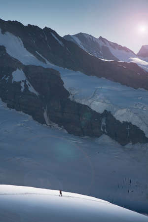 Lone climber on a glacier descending from the Jungfrau, Alps, Canton Bern, Switzerland
