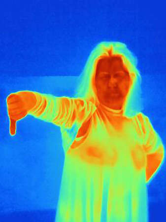 Thermal image of woman holding hand in thumbs downの写真素材