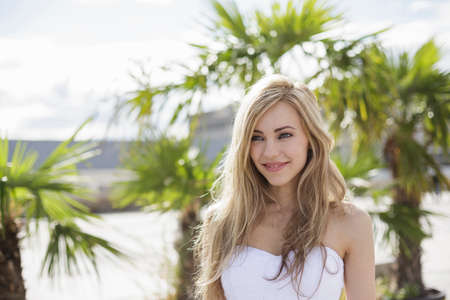 Beautiful long blond haired young woman in city