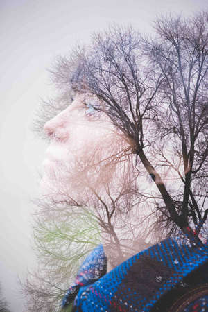 Young woman, side view and trees