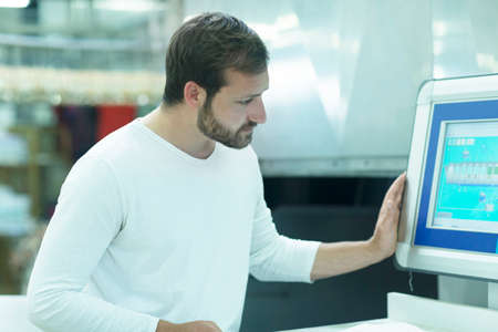 Man looking at computer monitor