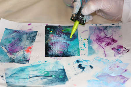 Cropped view of artist creating artwork with pipetteの写真素材