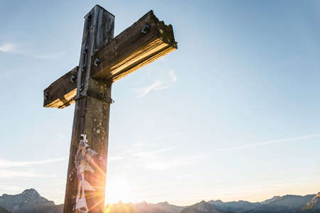 Summit cross on sunny day, Kleinwalsertal, Austriaの写真素材