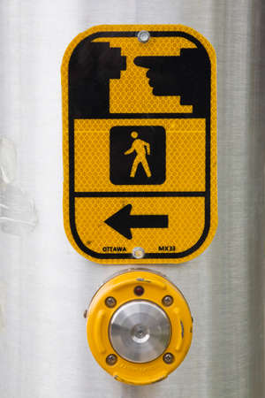 Button and instruction sign on pedestrian crossingの写真素材