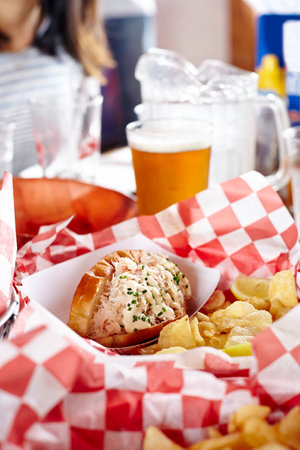 Fast food in basket on table, close-upの写真素材