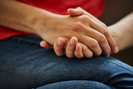 Cropped view of mother and son holding hands