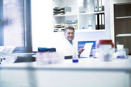 Happy scientist in laboratory