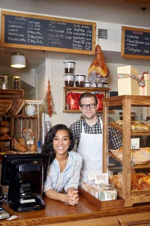 Portrait of male and female worker in bakery