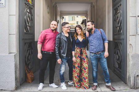 Group of friends in front of building entrance