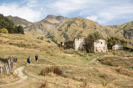 Male hikers hiking in mountain landscape, Svaneti, Georgiaの写真素材
