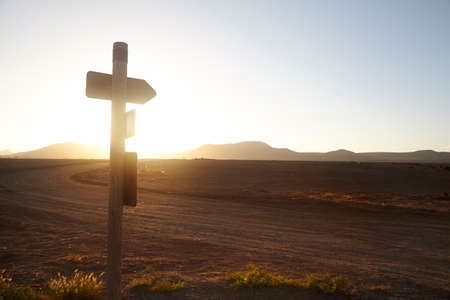 Sign post on roadside, El Cotillo, Fuerteventura, Spainの写真素材