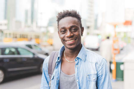 Portrait of man looking at camera smiling, Milan, Italy