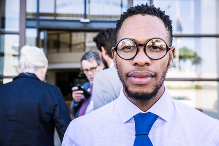Portrait of businessman outside office building