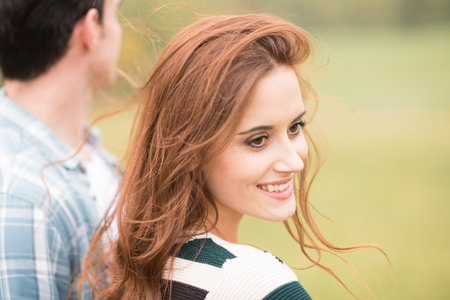 Portrait of woman looking over shoulder smiling